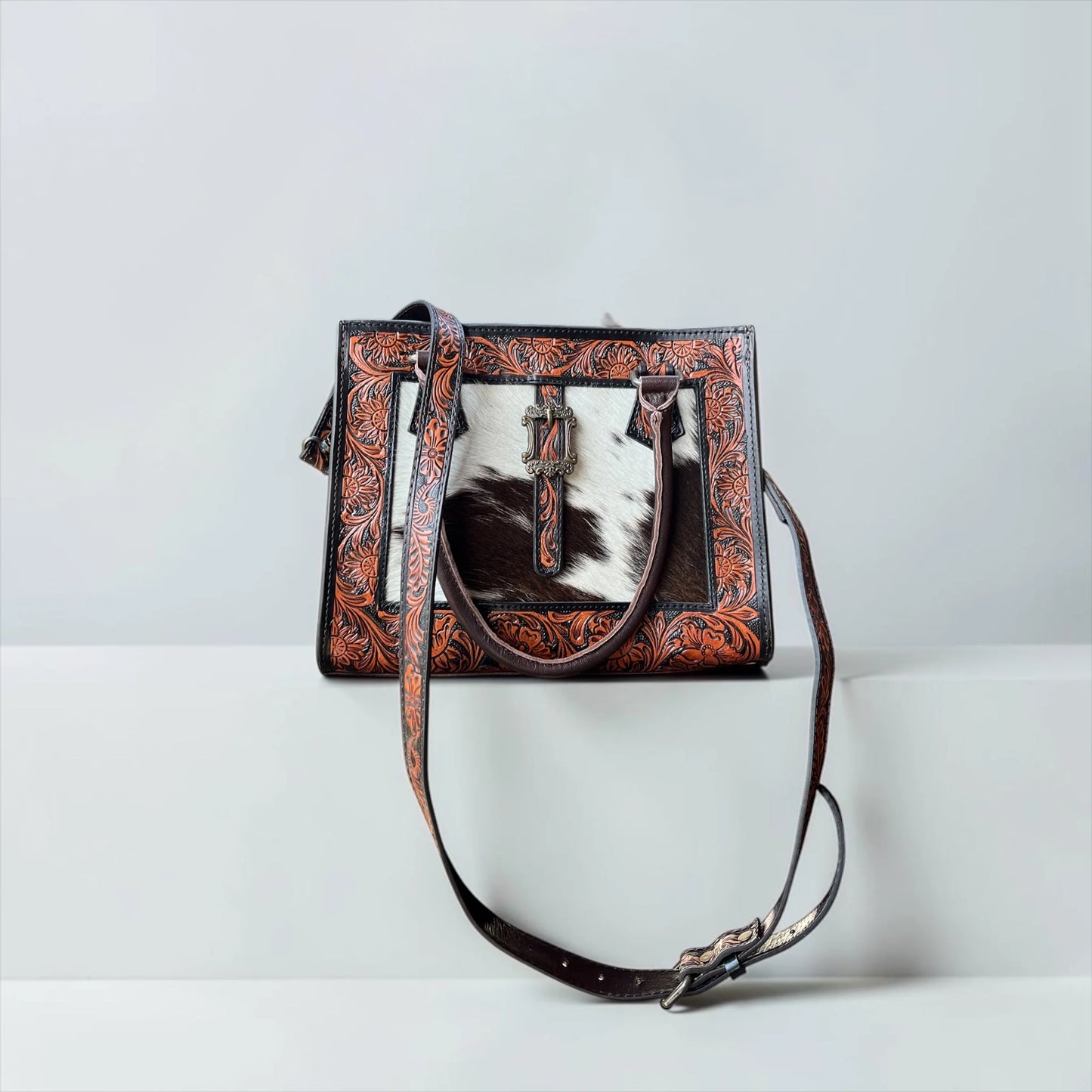 BROWN TOOLED LEATHER BUCKLE